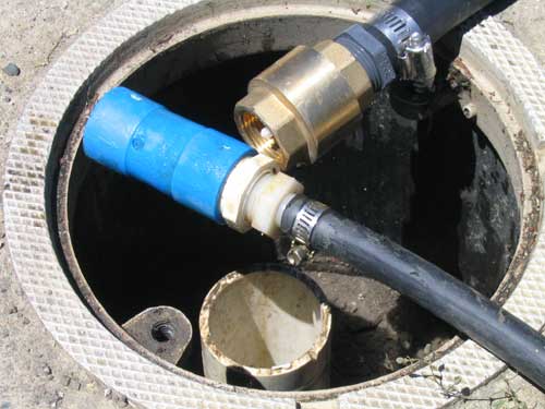 Top of well with half inch and three quarter inch pumping tubes with bottom check valves